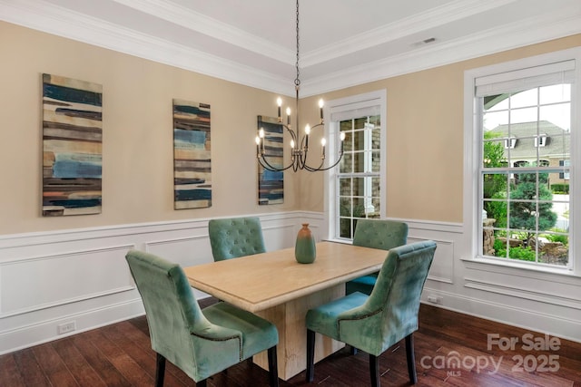 dining space featuring a healthy amount of sunlight, crown molding, and dark wood-type flooring