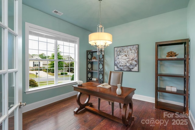 office space featuring french doors and dark hardwood / wood-style floors