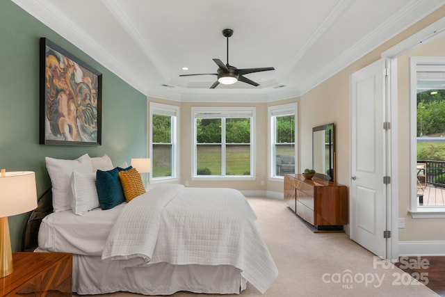 bedroom featuring ceiling fan, crown molding, and light carpet