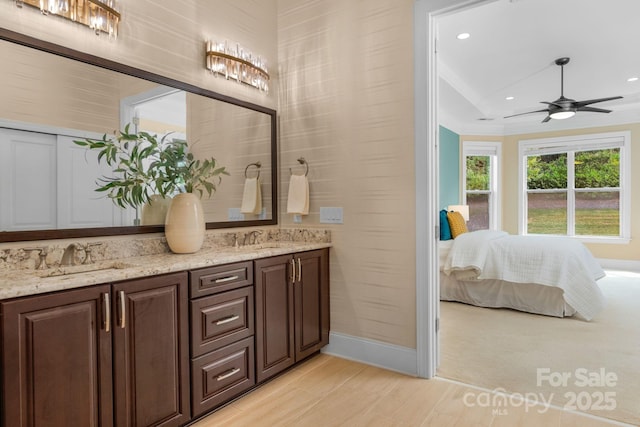 bathroom featuring vanity and ceiling fan