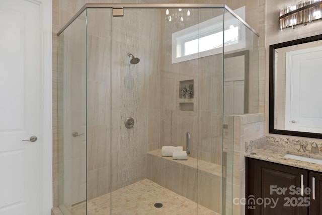 bathroom with vanity and walk in shower