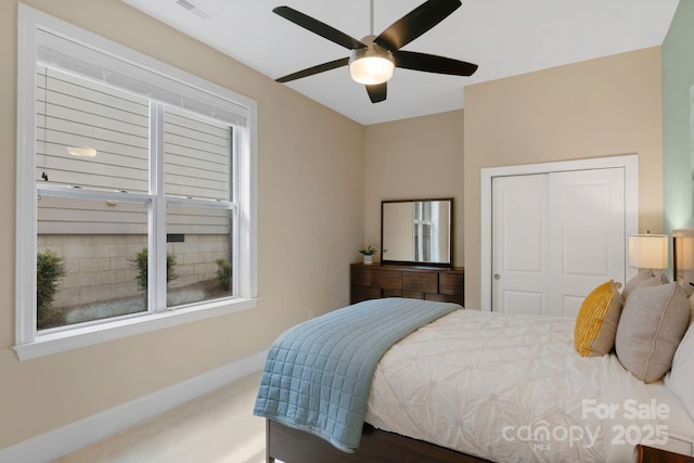 bedroom featuring carpet, a closet, and ceiling fan