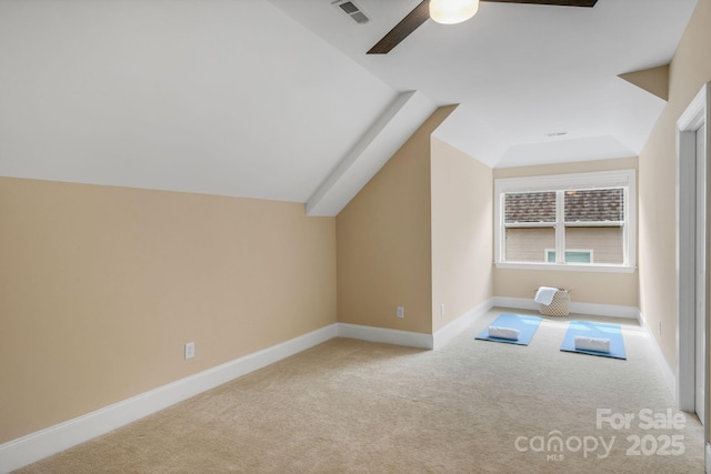 bonus room featuring ceiling fan, lofted ceiling, and light carpet