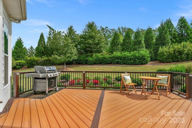 wooden terrace featuring grilling area