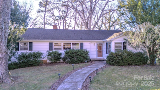 ranch-style home with a front yard