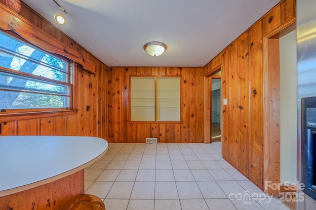 interior space featuring wood walls