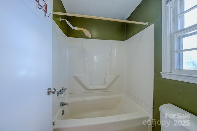 bathroom with toilet and shower / tub combination