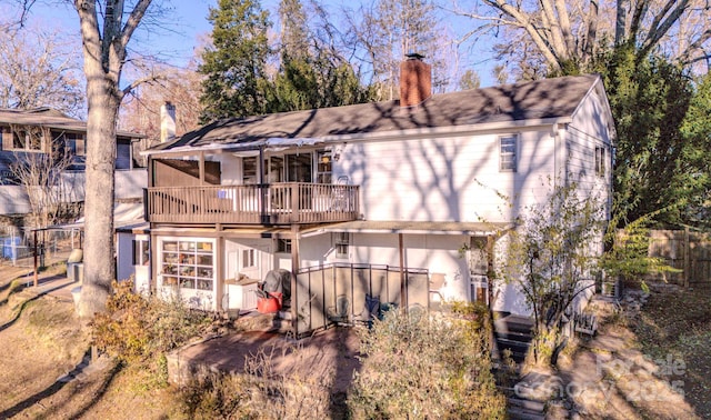 back of house with a balcony