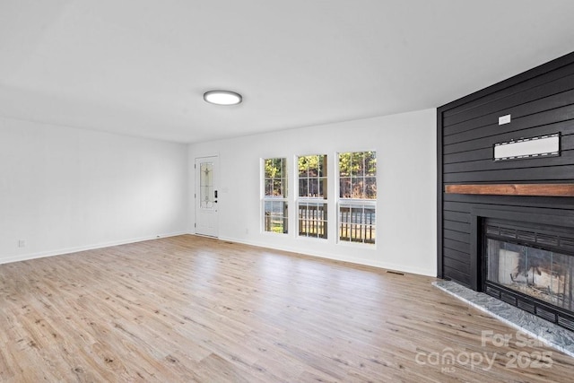 unfurnished living room featuring light hardwood / wood-style floors