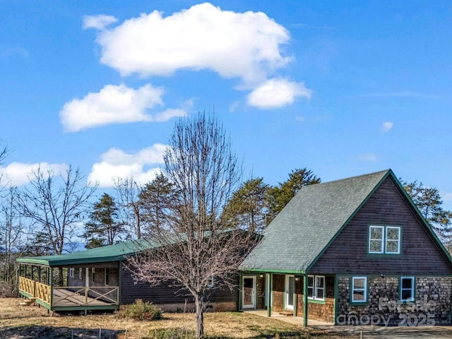 view of front of house featuring a wooden deck