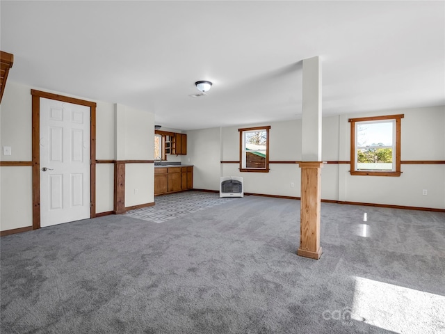 interior space with carpet flooring and heating unit