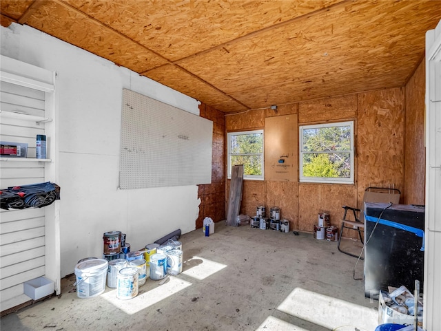 miscellaneous room featuring wooden walls