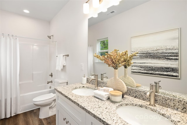 full bathroom with toilet, vanity, shower / tub combo, and hardwood / wood-style flooring