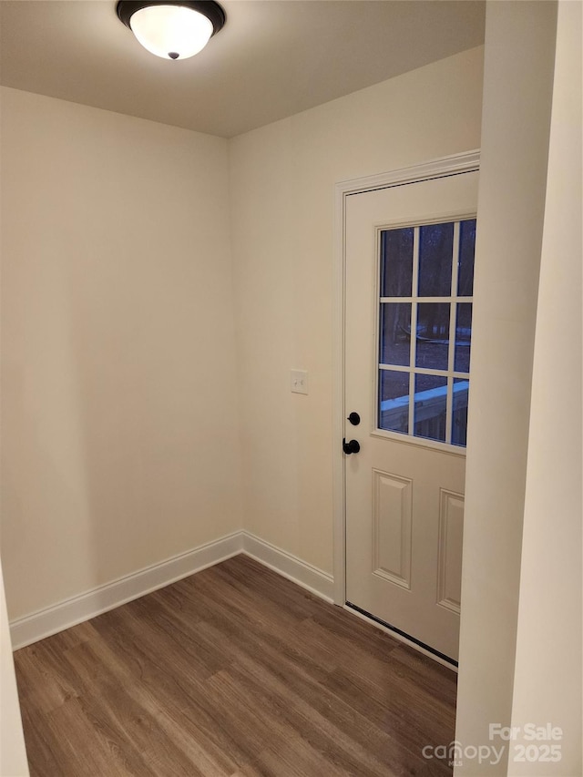 entryway with dark wood-type flooring