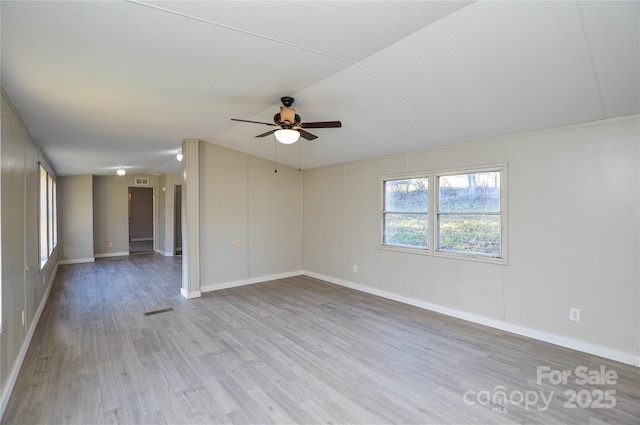 unfurnished room featuring ceiling fan and light wood-type flooring