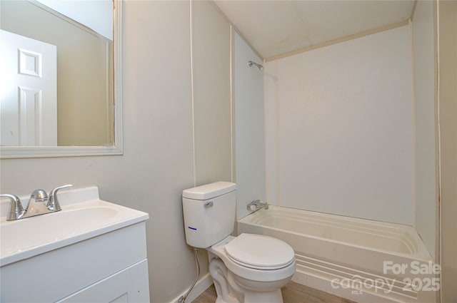 full bathroom featuring toilet, vanity, and bathing tub / shower combination