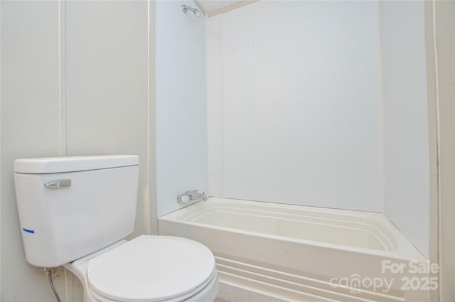 bathroom featuring toilet and shower / washtub combination