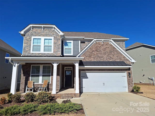 craftsman-style home with covered porch and a garage