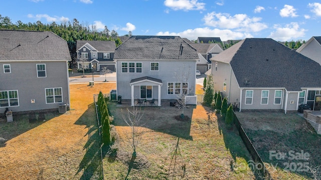 back of house with a patio area and central AC