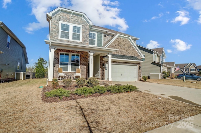 craftsman house featuring central AC, covered porch, and a front yard