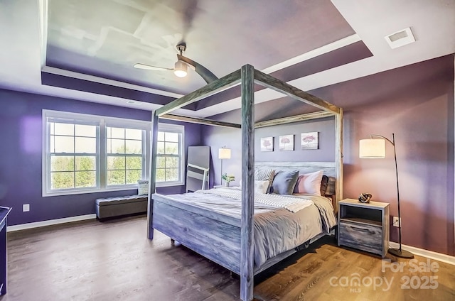 bedroom with ceiling fan and wood-type flooring