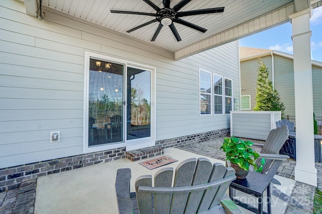 view of patio featuring ceiling fan