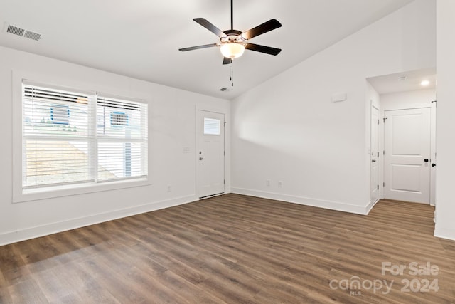 entrance foyer featuring ceiling fan, lofted ceiling, and dark wood-type flooring