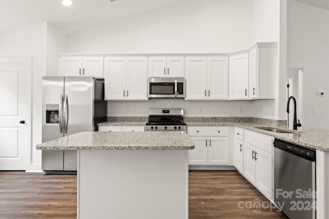 kitchen featuring light stone countertops, stainless steel appliances, sink, white cabinets, and dark hardwood / wood-style floors