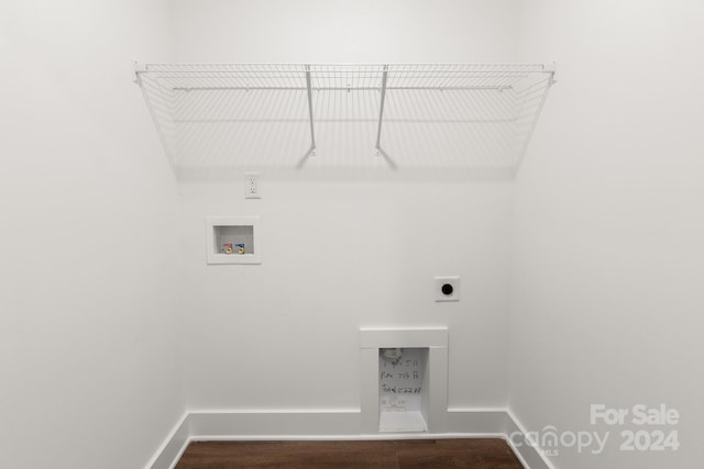 clothes washing area with washer hookup, electric dryer hookup, and dark hardwood / wood-style flooring