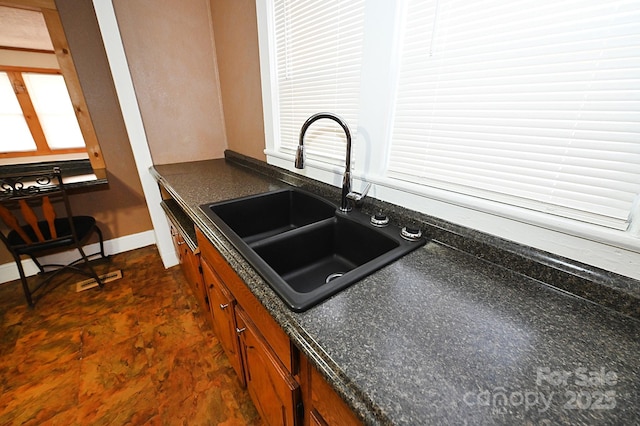 kitchen featuring sink and a wealth of natural light