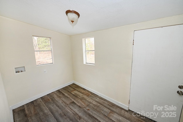 unfurnished room featuring dark hardwood / wood-style flooring