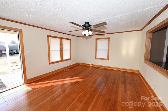 unfurnished room featuring hardwood / wood-style flooring, ceiling fan, crown molding, and a textured ceiling