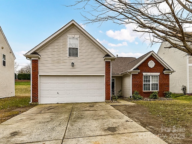 front facade with a garage and a front yard