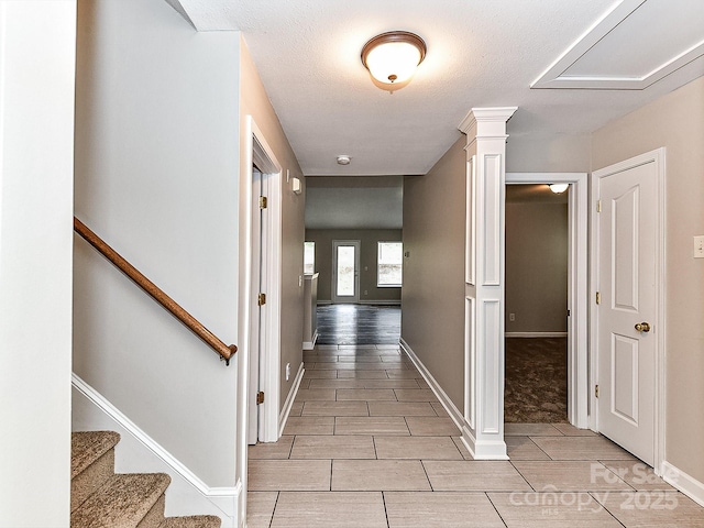 hall featuring ornate columns