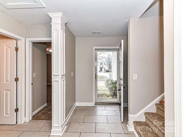 foyer featuring ornate columns