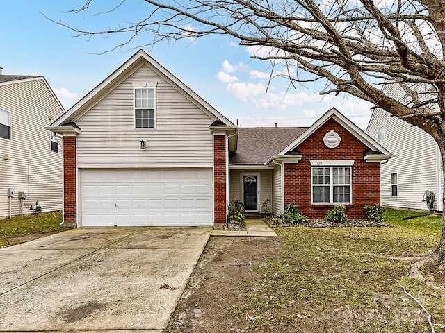 view of front property with a garage and a front lawn