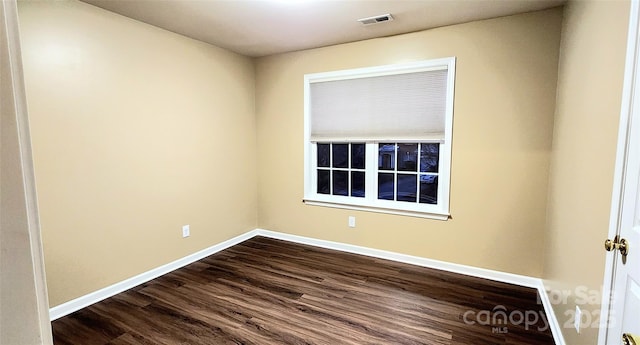 spare room featuring hardwood / wood-style floors