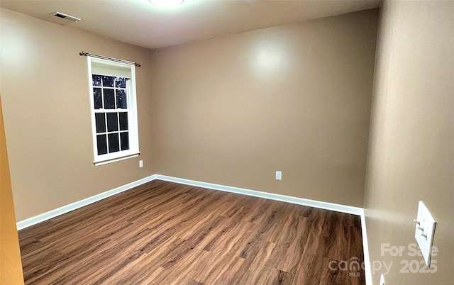 empty room featuring hardwood / wood-style floors