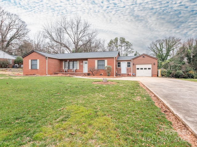 single story home with a front yard and a garage