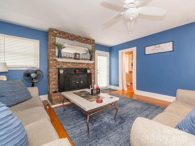 living room with hardwood / wood-style flooring and ceiling fan