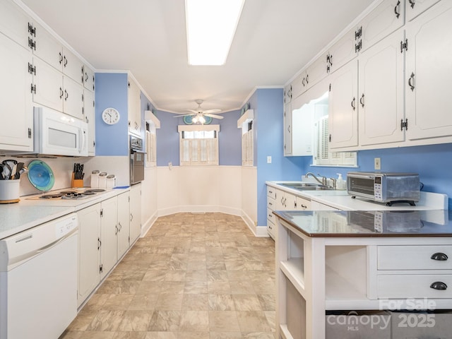 kitchen featuring white cabinets, white appliances, ceiling fan, and crown molding