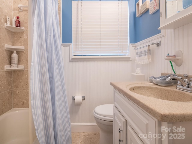 full bathroom with shower / bathtub combination with curtain, tile patterned flooring, vanity, and toilet