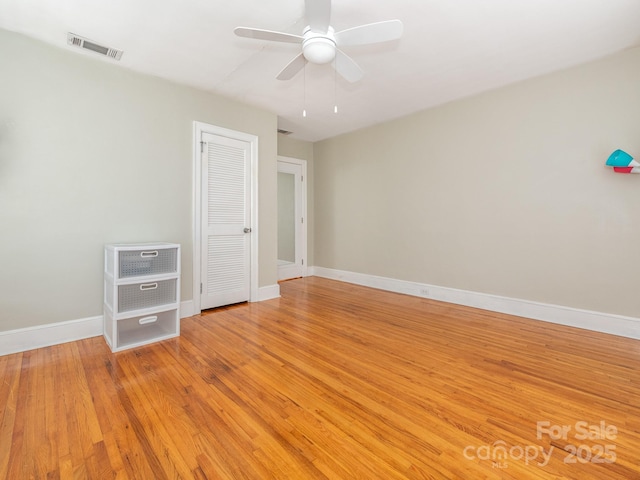 unfurnished bedroom featuring light wood-type flooring and ceiling fan