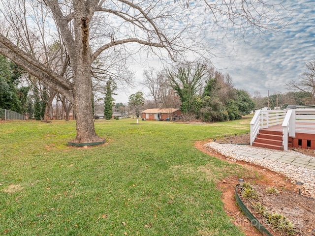 view of yard with a wooden deck