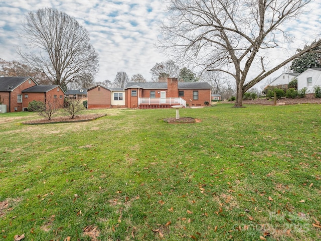 view of yard with a wooden deck