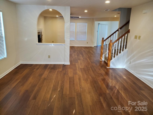 unfurnished room with dark hardwood / wood-style floors