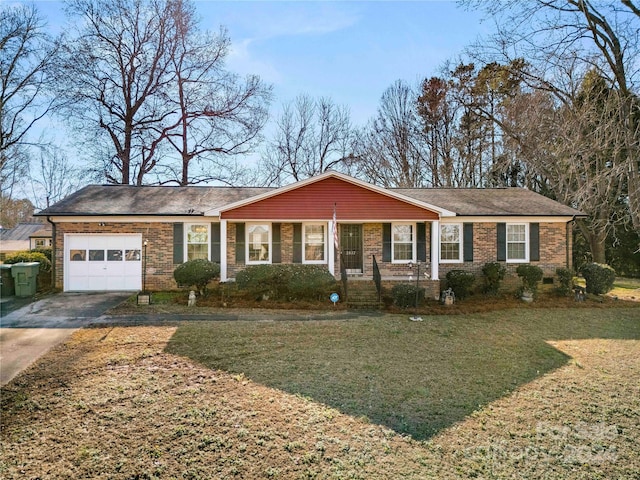 ranch-style house featuring a garage and a front lawn