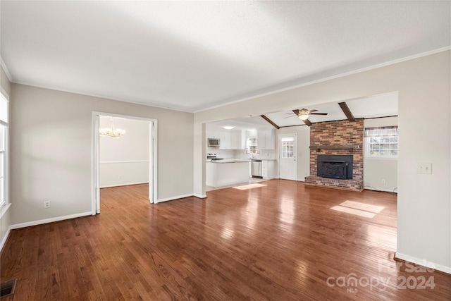 unfurnished living room featuring beamed ceiling, ceiling fan with notable chandelier, wood-type flooring, and a fireplace