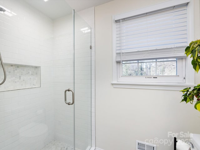 bathroom featuring walk in shower