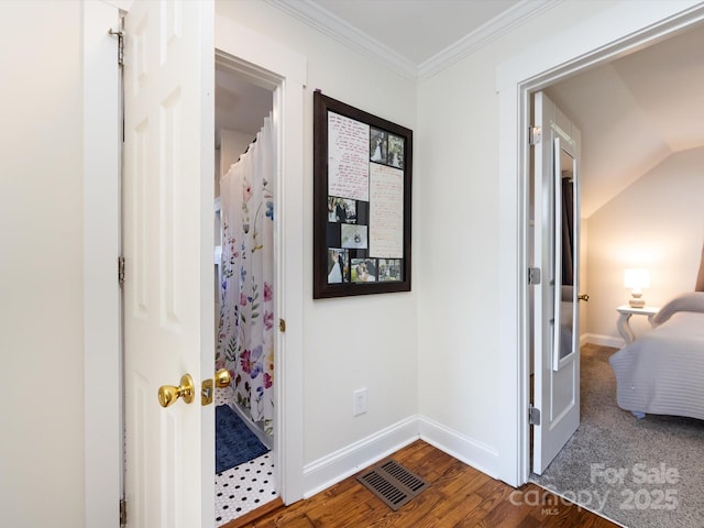 hallway featuring crown molding and dark wood-type flooring